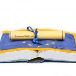 European union law on the European union flag , and Law book on the white background